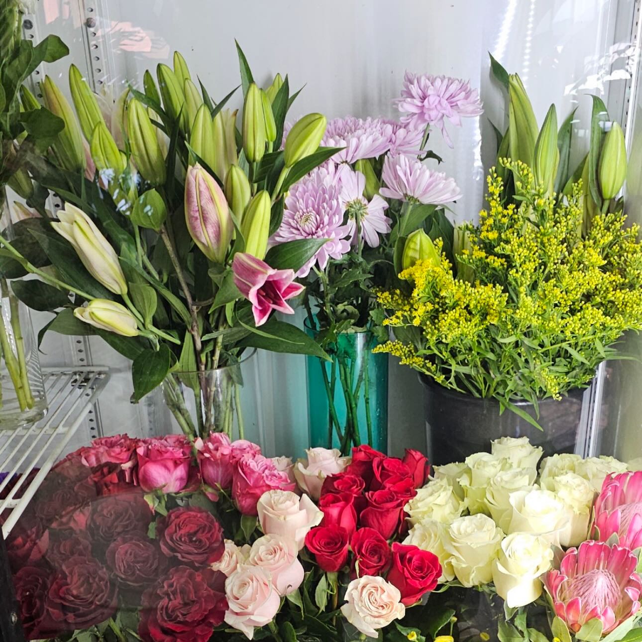Walk-in cooler with fresh roses and lilies