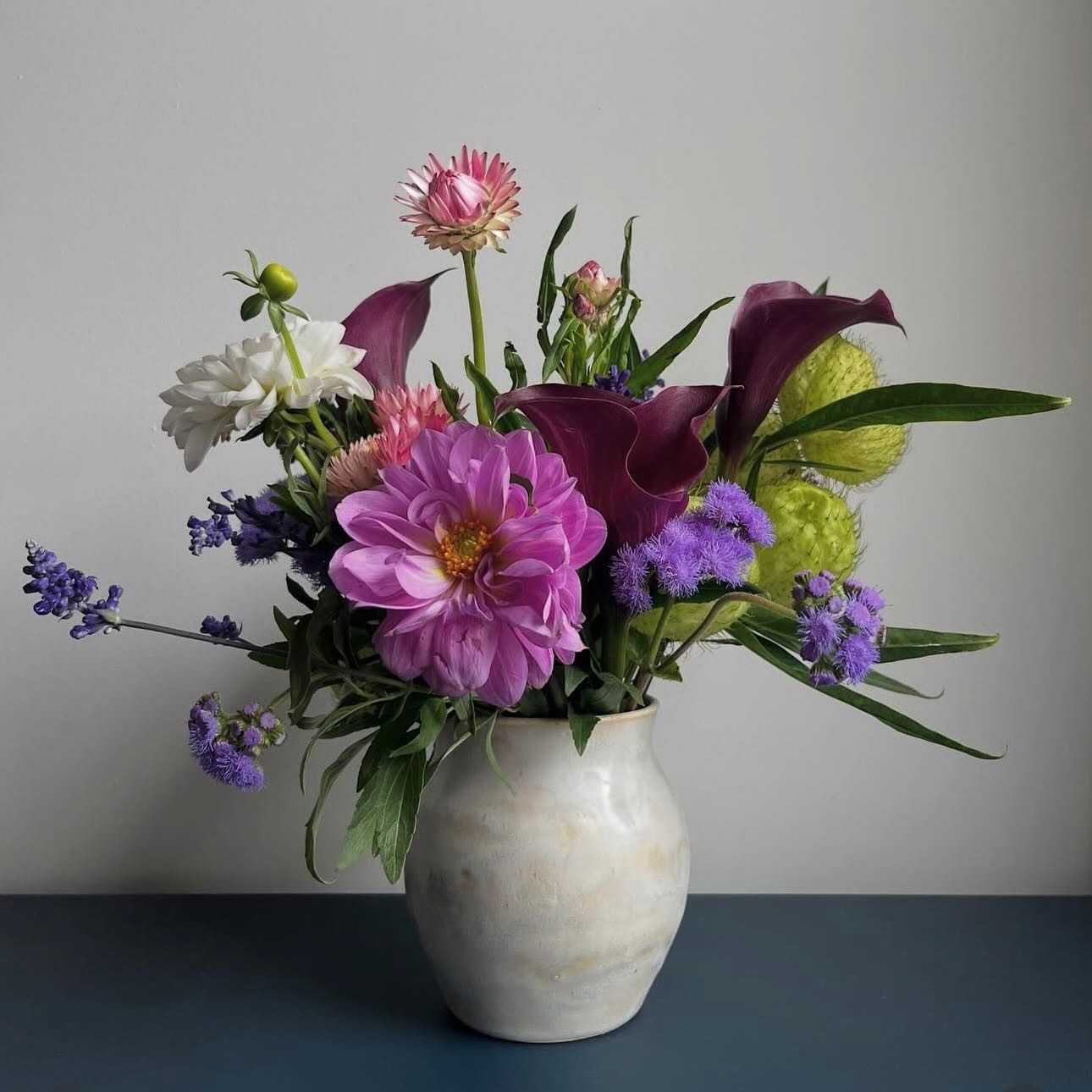 Designer single-vase arrangement with dahlia, calla lily, dianthus